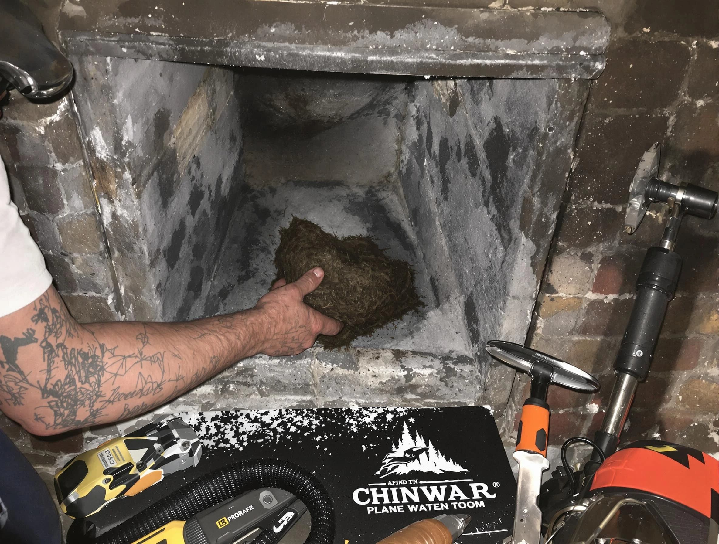 Ohio Chimney Sweep safely removing debris and screening chimney in Ohio, PA
